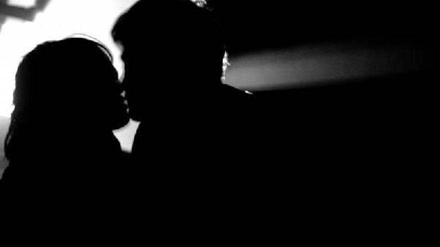 Winter cinema hallway with a woman walking alone at night, soft light and warm atmosphere