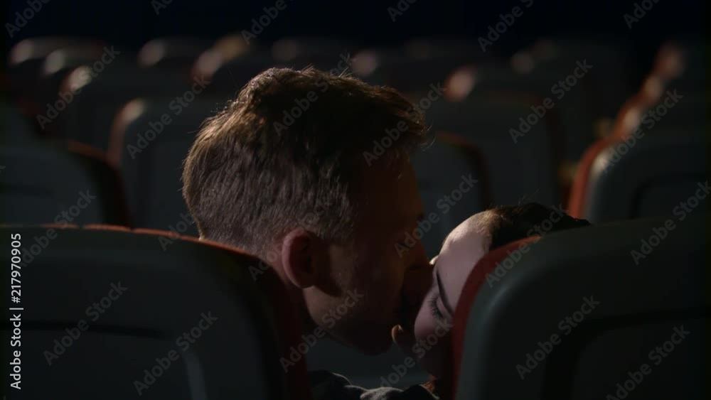 couple intimacy in movie theater