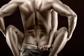 Confident masculine silhouette representing the elite Bull role in cuckold dynamics