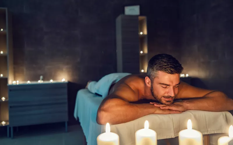 Man relaxing in a wellness setting representing modern male health and prostate care